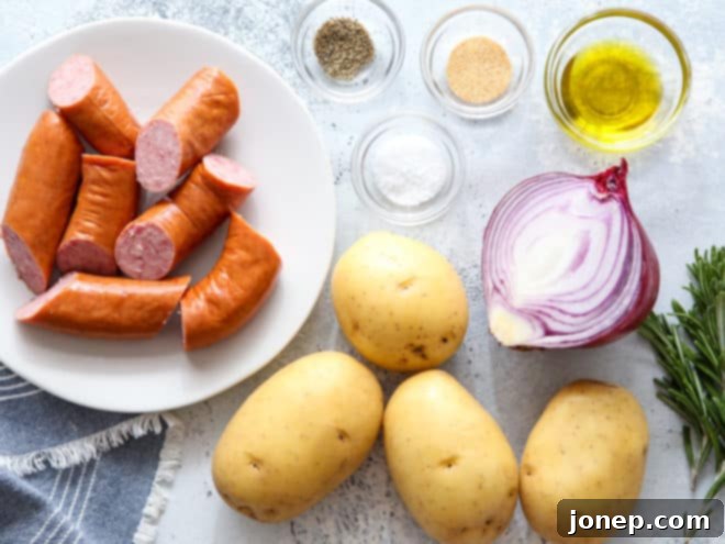 mixing sausage, potatoes and onions together