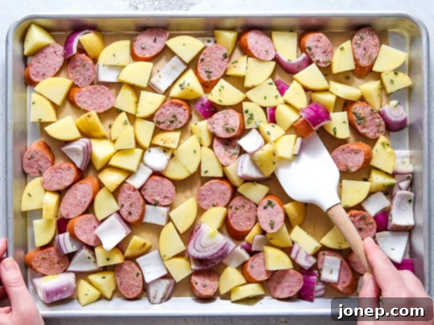 Sheet pan sausage and potatoes ready to bake