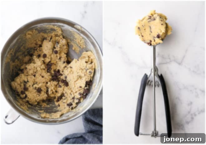 A large bowl filled with classic chocolate chip cookie dough, positioned next to a cookie scoop precisely loaded with a perfect, ready-to-freeze portion.