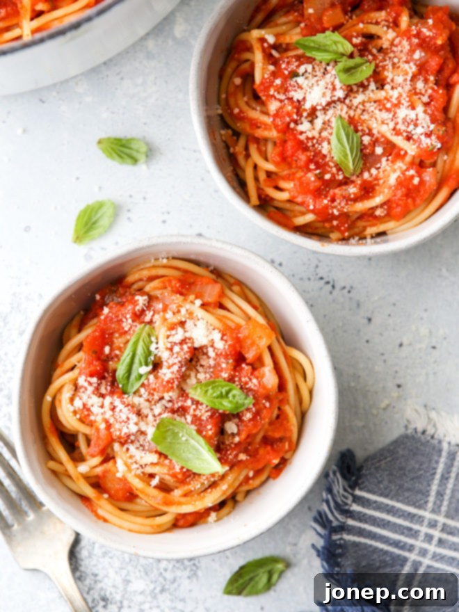 This easy homemade marinara sauce is made with simple staple ingredients like canned tomatoes, onion, garlic, and herbs. Use it with pasta, casseroles and more!
