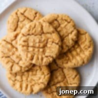 Simply 4-Ingredient Flourless Peanut Butter Cookies 7 flourless peanut butter cookies stacked on a plate