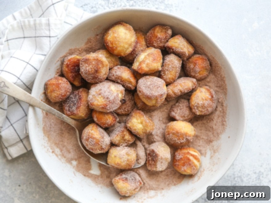 Coat pretzel bites with butter and cinnamo-sugar