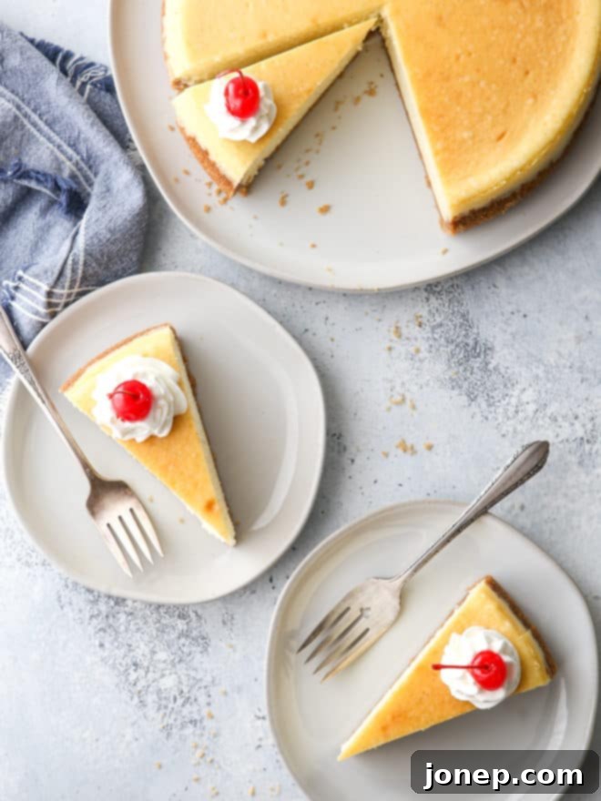 Classic cheesecake with graham cracker crust is silky smooth, ultra rich, and very creamy.