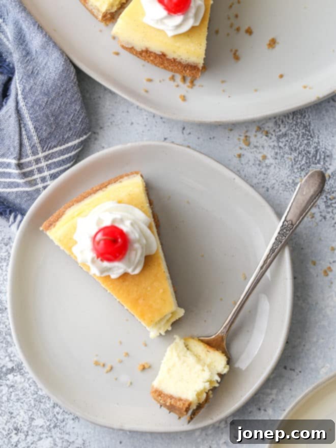 Classic cheesecake with graham cracker crust is silky smooth, ultra rich, and very creamy.