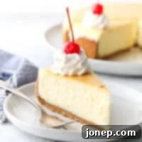 Classic cheesecake with graham cracker crust is silky smooth, ultra rich, and very creamy.