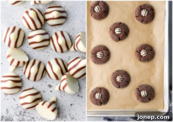 Chocolate cookies with Hershey's Hugs pressed into the center on a baking sheet