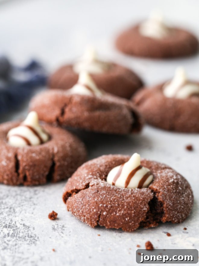 A close-up of a Chocolate Hugs Cookie with a perfectly melted Hershey's Hug