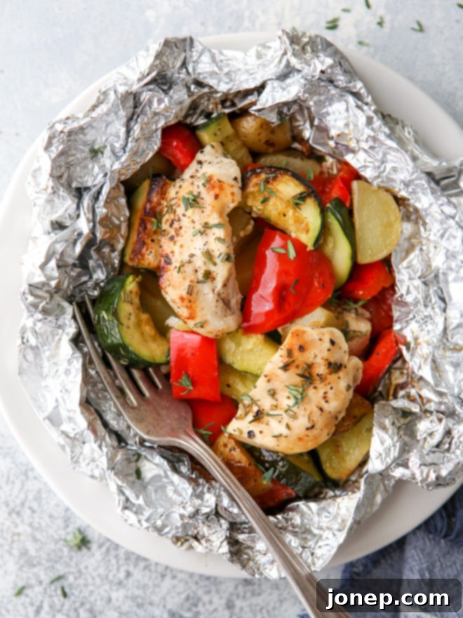 Delicious chicken and veggie tin foil dinners ready to be cooked