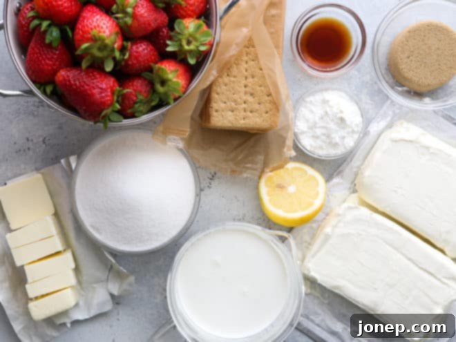 A collection of fresh ingredients ready for making no-bake strawberry cheesecake bars.