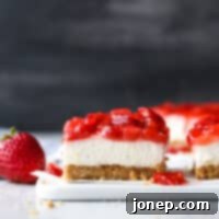 Delicious no-bake strawberry cheesecake bars ready to be served.