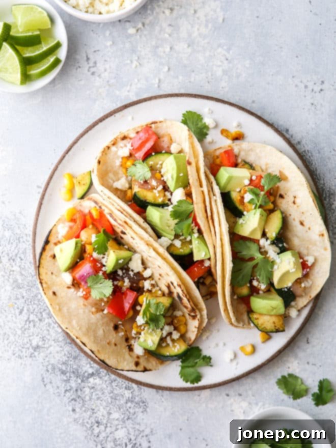 Simple grilled veggie tacos are fresh, healthy, and full of so much flavor, topped with avocado and cilantro