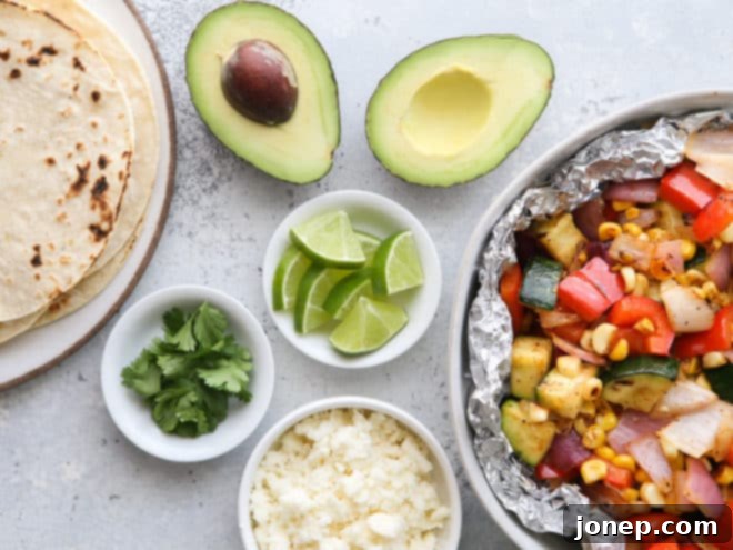 Taco fixings laid out, including grilled vegetables, avocado, cheese, and cilantro