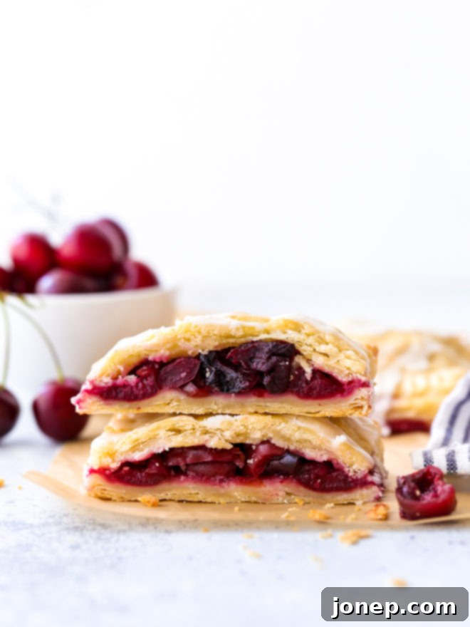 cherry hand pies cut in half and stacked