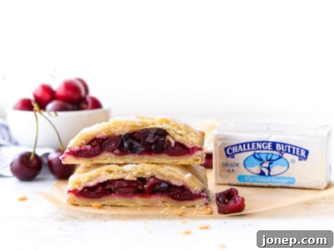 cherry hand pies cut in half and stacked with Challenge Butter