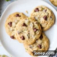 Chocolate Chip Cookies with a Zucchini Twist 10 Plate of freshly baked zucchini chocolate chip cookies with walnuts.
