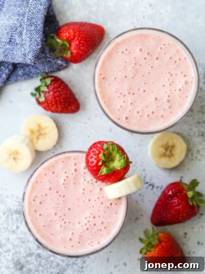 blended smoothies with strawberries and sliced bananas