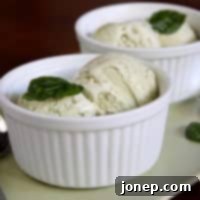 Gourmet Basil Ice Cream 2 A close-up image of a vibrant green scoop of basil ice cream.