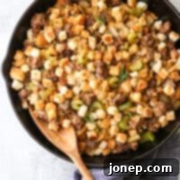 spoon in skillet stovetop sausage stuffing
