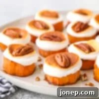 Pecan Marshmallow Sweet Potato Delights 8 Sweet potato bites with marshmallows and pecans on a platter