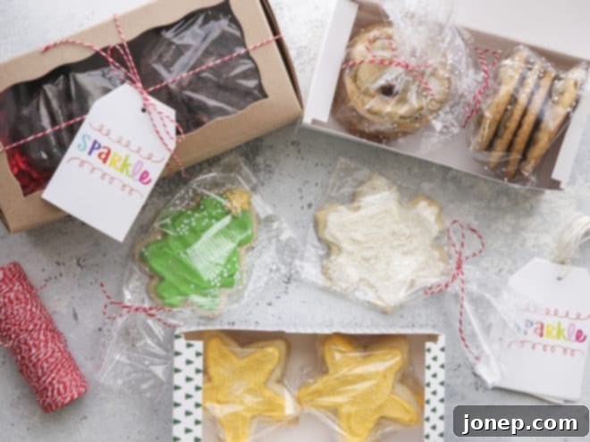 Hands meticulously packaging individually wrapped cookies into decorative boxes, then placing them into a larger padded shipping box.