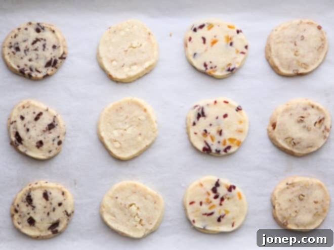 A fresh batch of golden-brown baked shortbread cookies cooling on a wire rack, showcasing their crisp edges and delightful appearance.