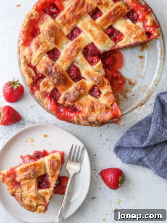 Sweet and Tangy Strawberry Rhubarb Pie 3 strawberry rhubarb pie with a slice on a plate