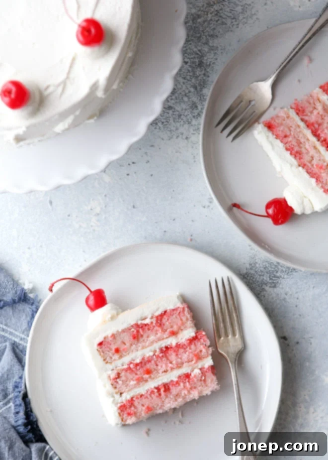 This cherry chip cake, smothered in a fluffy whipped vanilla buttercream, is a homemade version of a boxed cake mix favorite. It’s also the perfect celebration cake!