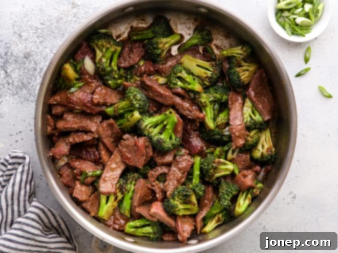 beef and broccoli stir fry in pan