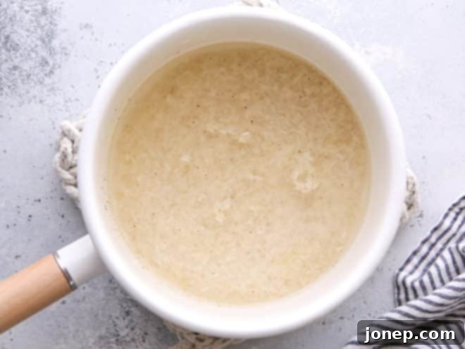 adding water to pot of rice