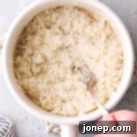 The Art of Flawless Rice 8 fluffing steamed rice in a pot
