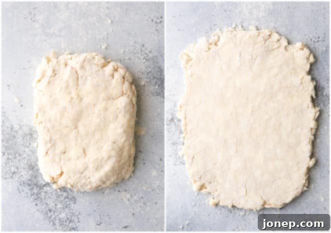 Forming puff pastry dough into a rectangle for the first turn, with visible butter pieces.