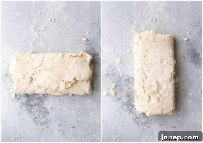 Making the first fold (turn) of puff pastry dough, demonstrating the classic letter fold.