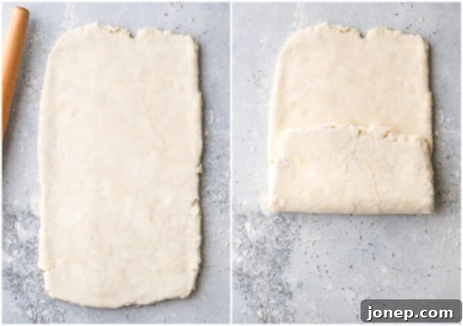 Rolling puff pastry dough for the 4th turn, showing a much smoother texture compared to earlier stages.