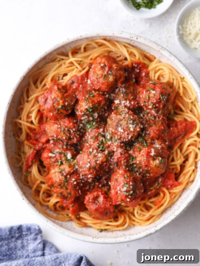 a big bowl of spaghetti with meatballs