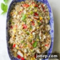 Vibrant grilled chicken quinoa salad in a blue ceramic dish