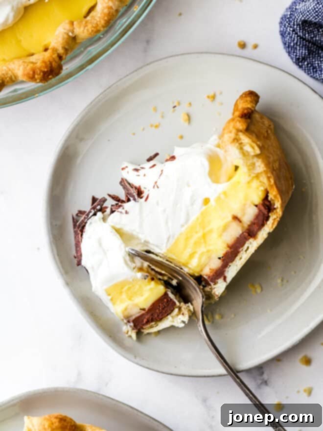 taking a bite out of chocolate banana cream pie slice