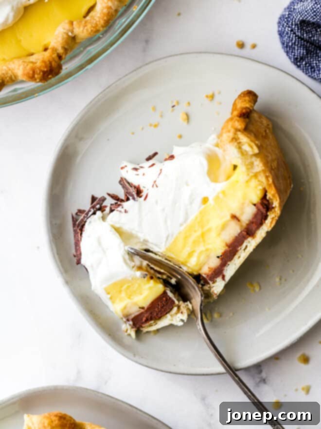 Decadent Chocolate Banana Bliss 4 taking a bite out of chocolate banana cream pie slice