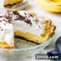 chocolate bottom banana cream pie with slices taken out so you can see the layers