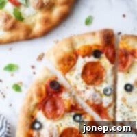 close up of piece of pepperoni pizza