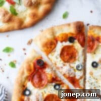 close up of piece of pepperoni pizza