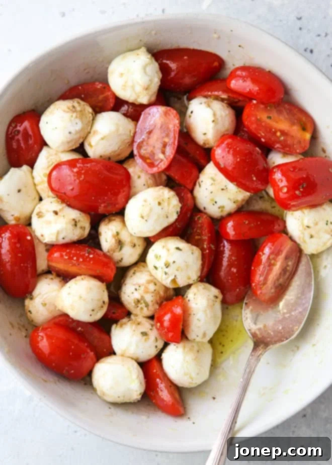marinated tomatoes and mozzarella in olive oil and herbs