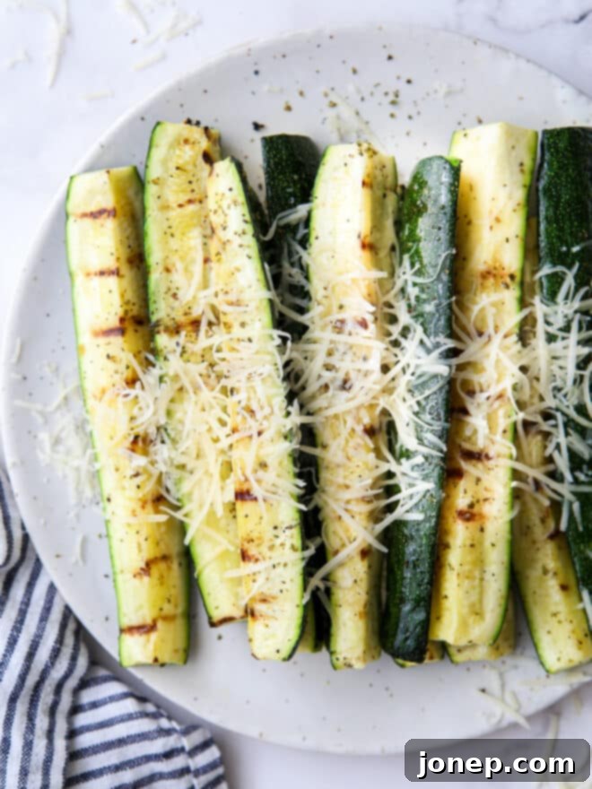 Parmesan-Crusted Grilled Zucchini 5 close up of grilled parmesan zucchini on a plate