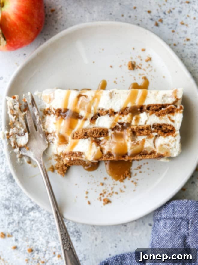 Close-up of a slice of caramel apple gingersnap icebox cake, showing layers