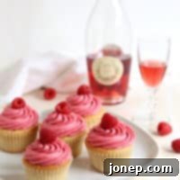 Blush Raspberry Rose Cupcakes 2 A beautifully frosted Raspberry Rosé Cupcake ready to eat.