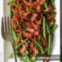 Crispy Bacon and Shallot Green Beans 8 closeup of green beans with crispy shallots and bacon on a platter with fork