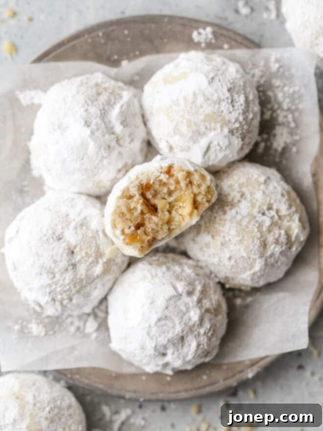snowball cookies with bite taken out of one