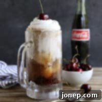 Bourbon Cherry-Cola Floats, a refreshing adult summer drink from completelydelicious.com