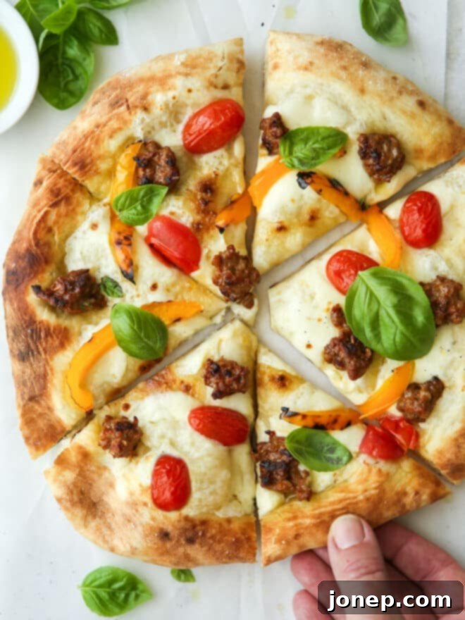 Classic Italian Sausage Pizza with Roasted Peppers, Tomatoes, and Basil