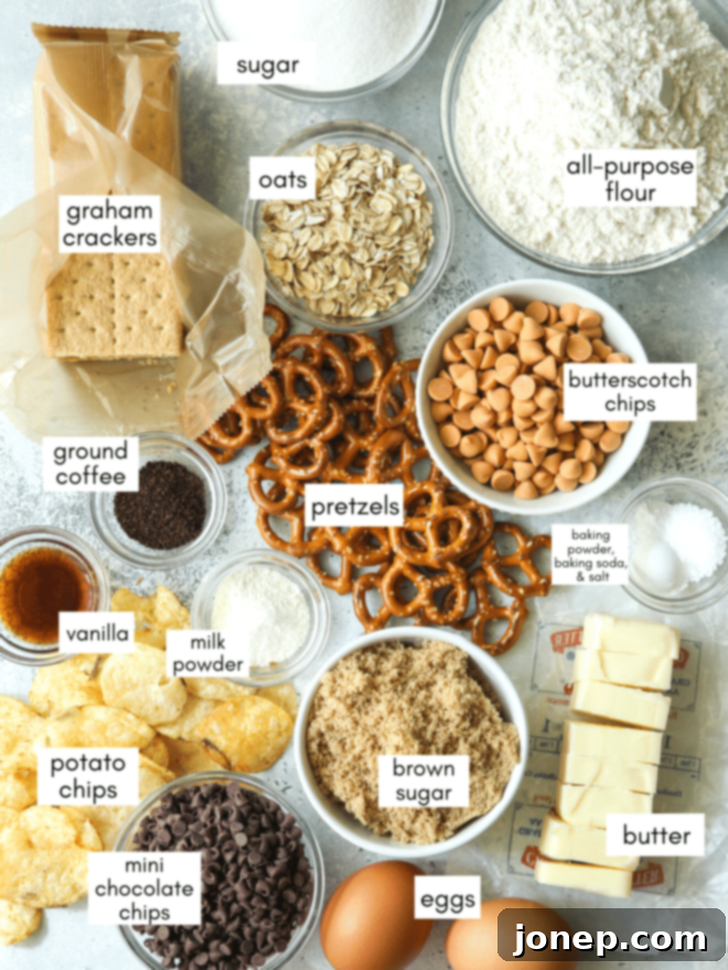 Pantry Raid Cookies 3 A selection of ingredients laid out for kitchen sink cookies, including flour, sugars, butter, eggs, and various mix-ins like pretzels, potato chips, chocolate chips, and graham crackers.