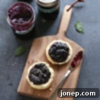 Zesty Blueberry Mojito Jam 2 A small jar of delightful Blueberry Mojito Jam, perfect for gifting or enjoying.